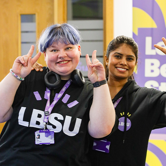 Student Community Organisers posing and smiling at the camera 
